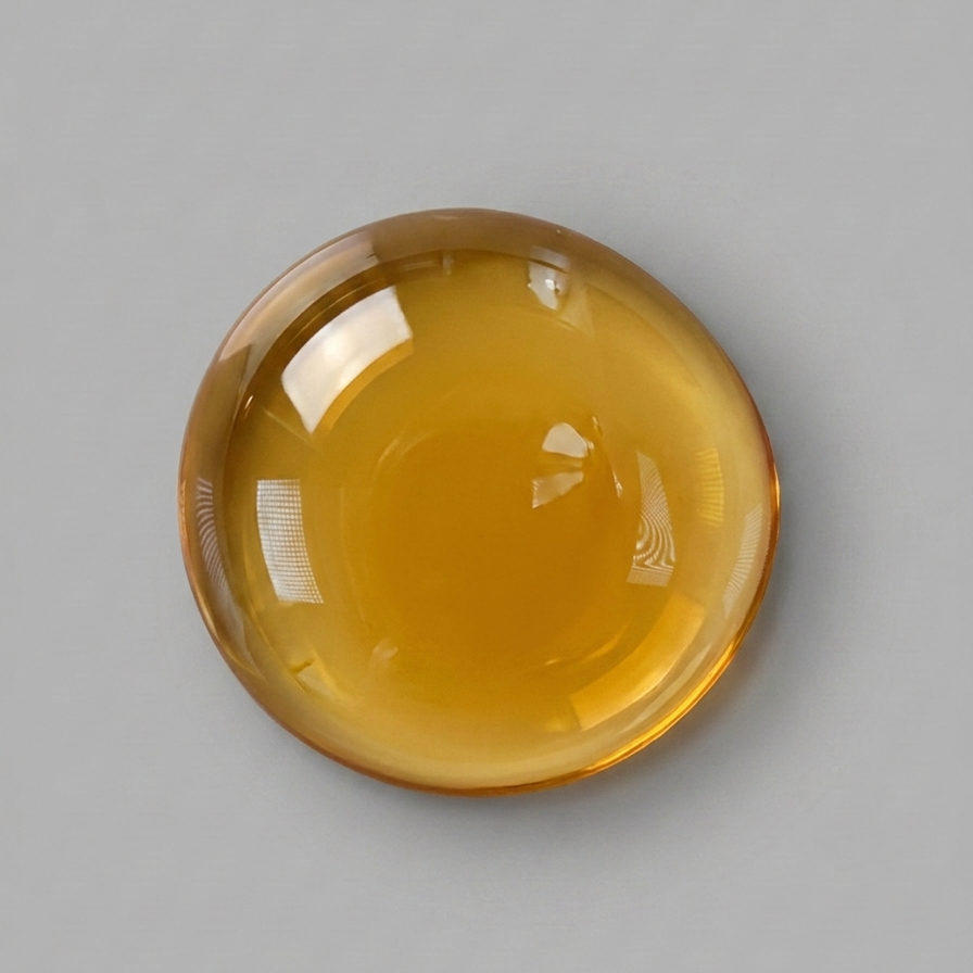 Amber-colored liquid on a gray background